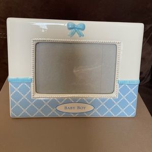 NWOT. Glass baby boy picture frame. Fits 4x6 photo. Never used.
